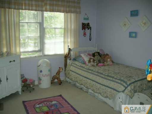 2 Michael Court Old Bridge, NJ 08857 - Photo 8 of 8 a living room with furniture and a window
