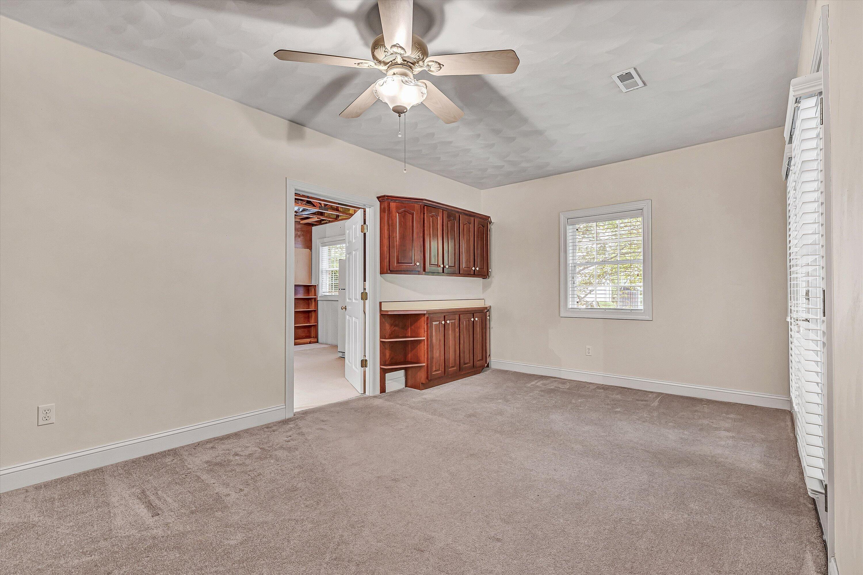 131 Stoney Mill Road Rocky Mount, VA 24151 - Photo 25 of 37 a view of a livingroom with a fireplace and a window