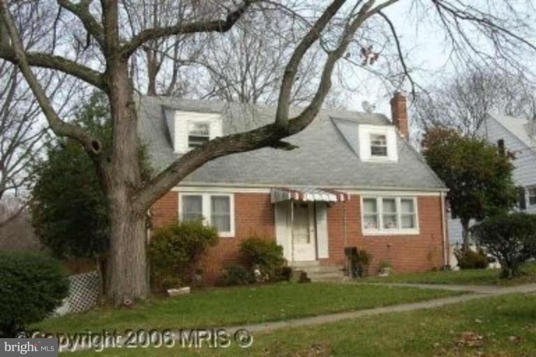 3609 Kayson Street Silver Spring, MD 20906 - Photo 1 of 1 a front view of a house with a yard and trees
