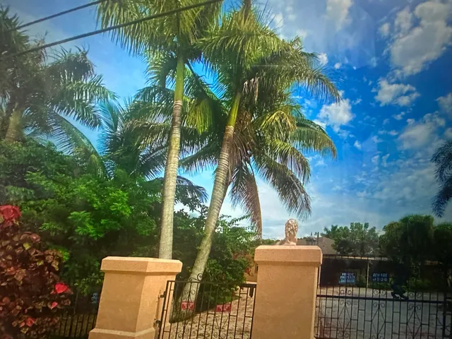 a bedroom with a bed and cupboard