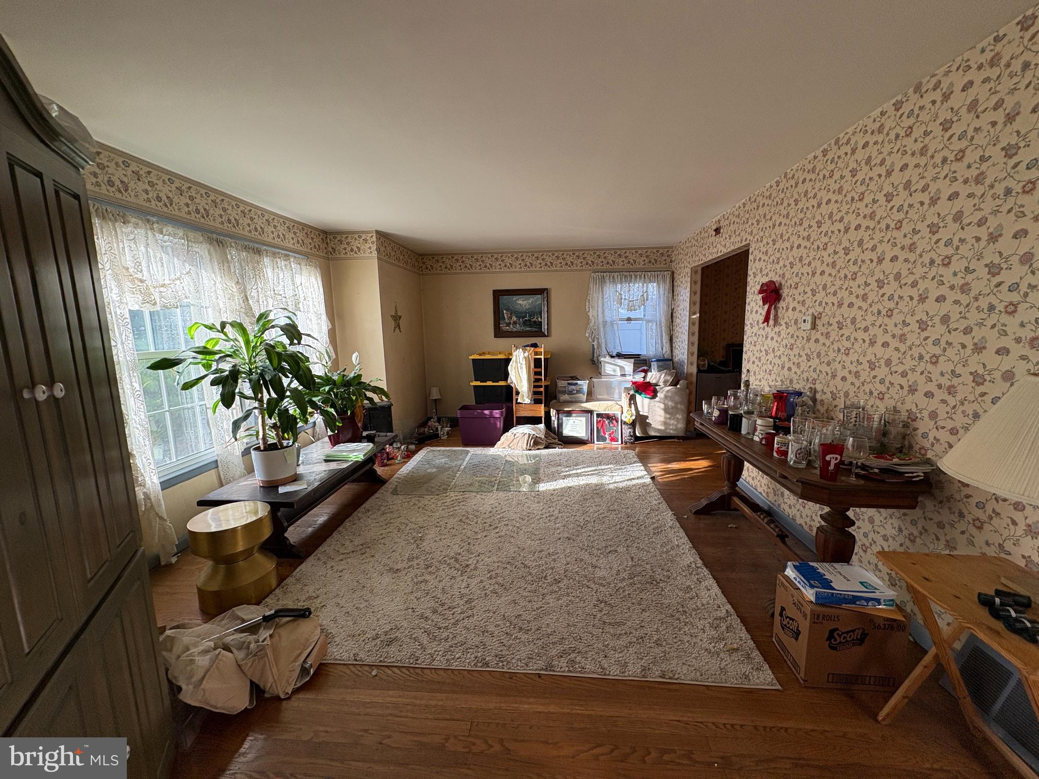 2204 New Albany Road Cinnaminson, NJ 08077 - Photo 6 of 22 a living room with furniture gym equipment and a flat screen tv