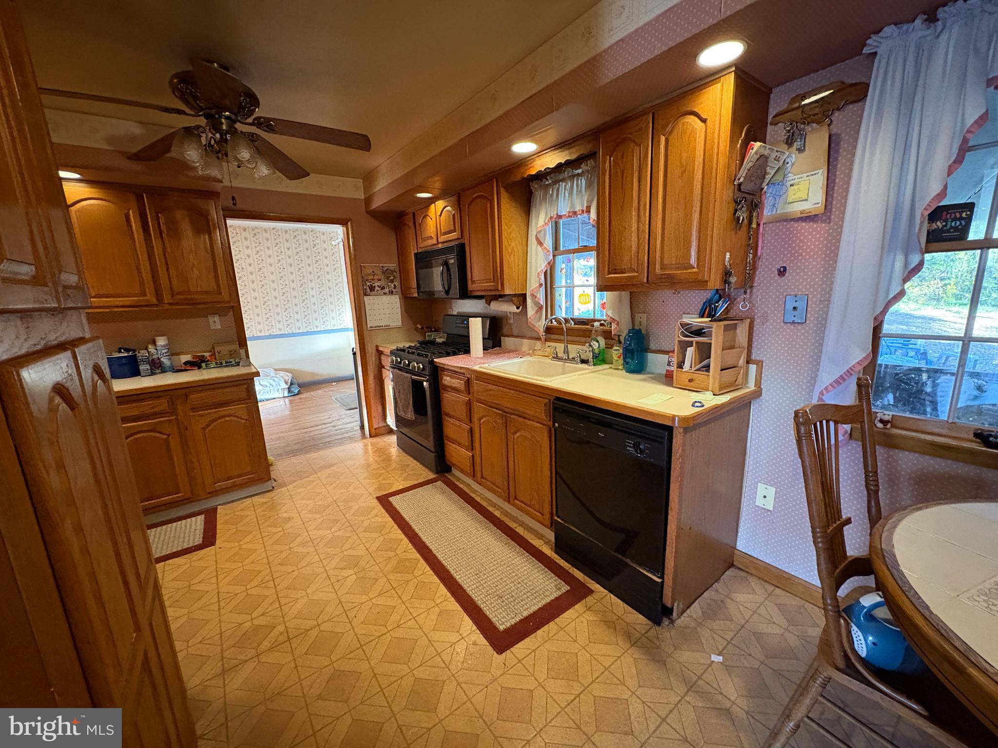 2204 New Albany Road Cinnaminson, NJ 08077 - Photo 9 of 22 a open kitchen with stainless steel appliances granite countertop a stove a sink and a refrigerator