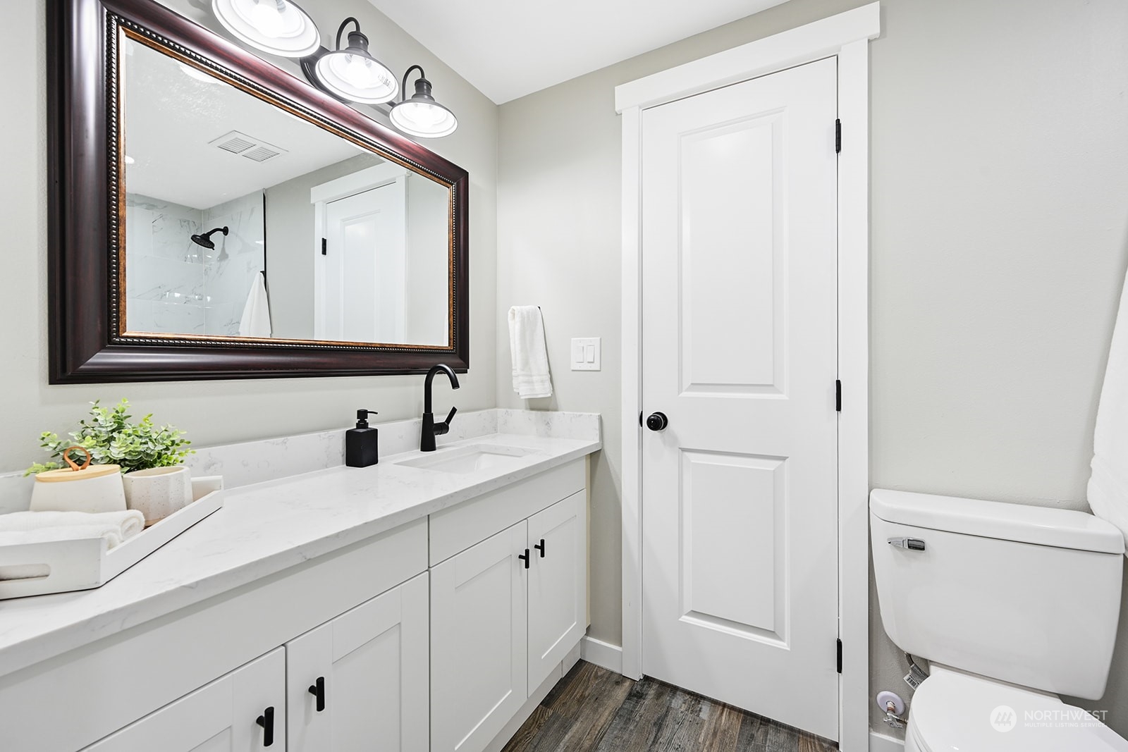 10841 Highway 12 Rochester, WA 98579 - Photo 16 of 23 a bathroom with a double vanity sink and a mirror