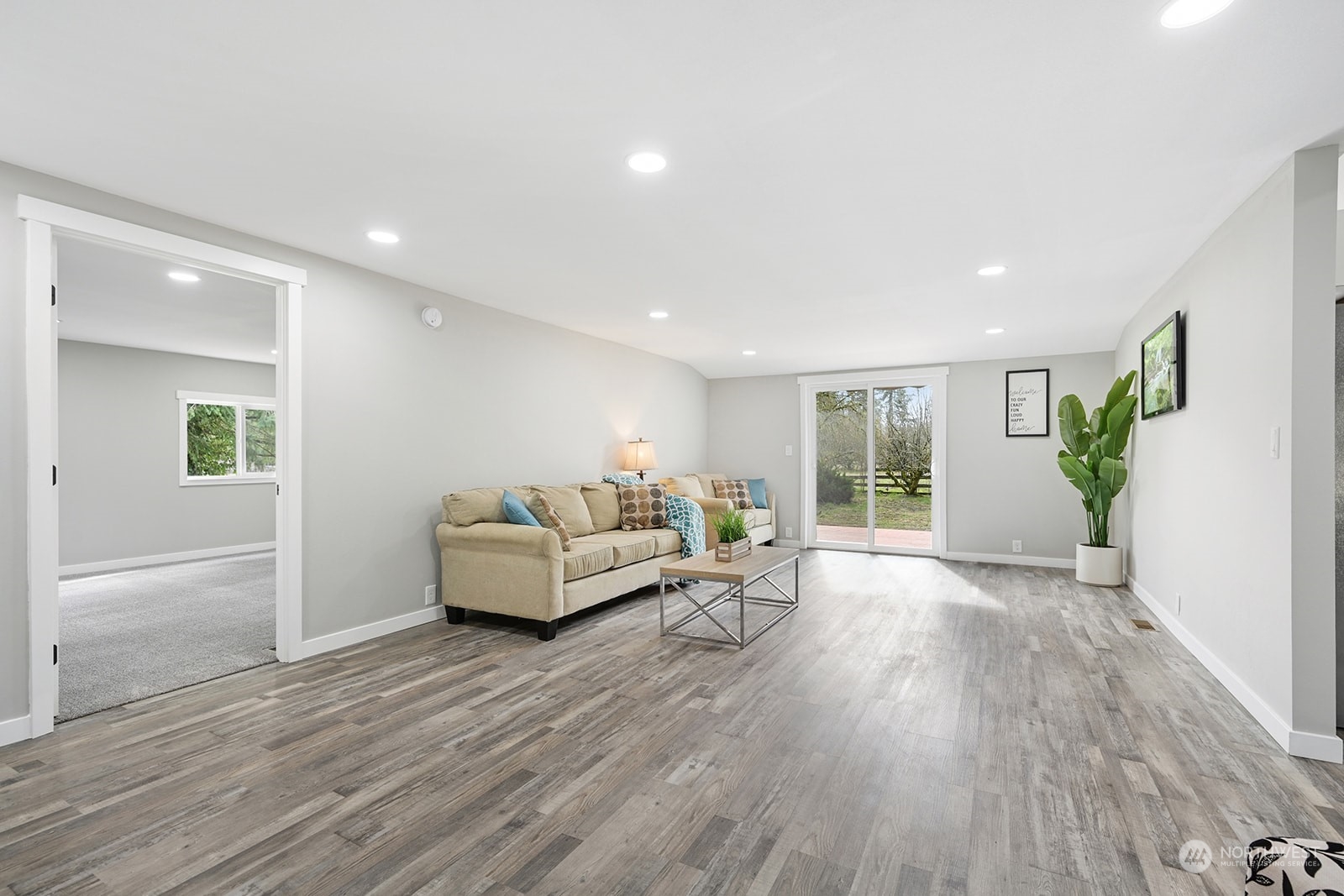10841 Highway 12 Rochester, WA 98579 - Photo 3 of 23 a living room with furniture and wooden floor