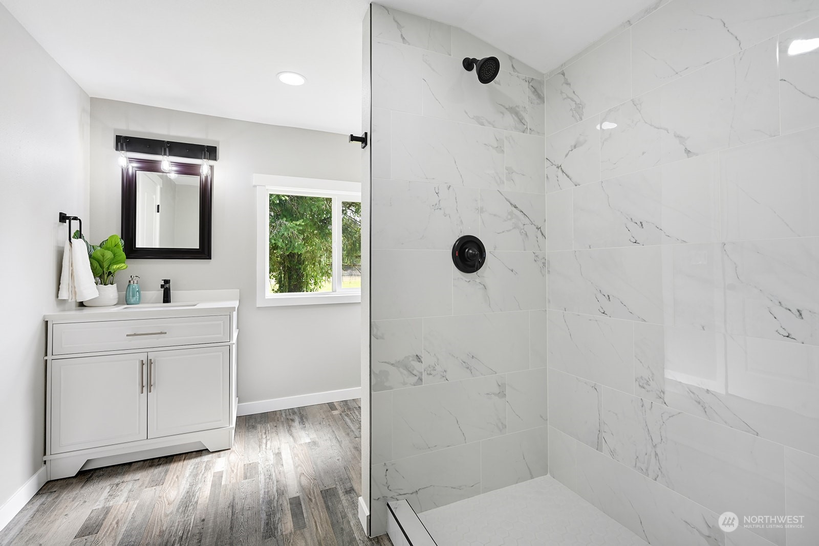 10841 Highway 12 Rochester, WA 98579 - Photo 9 of 23 a bathroom with a shower sink and mirror