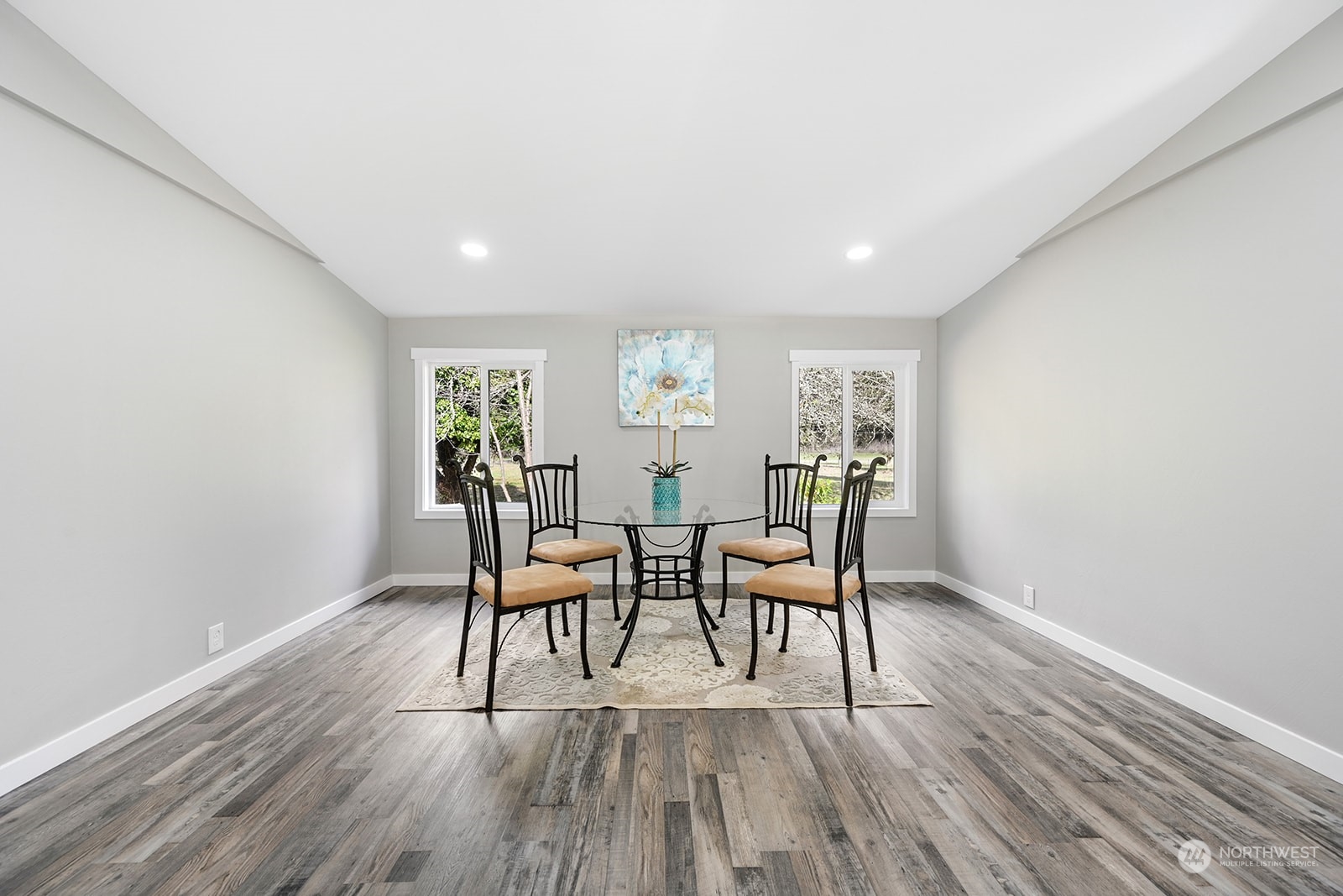 10841 Highway 12 Rochester, WA 98579 - Photo 10 of 23 a view of a dining room with furniture and wooden floor