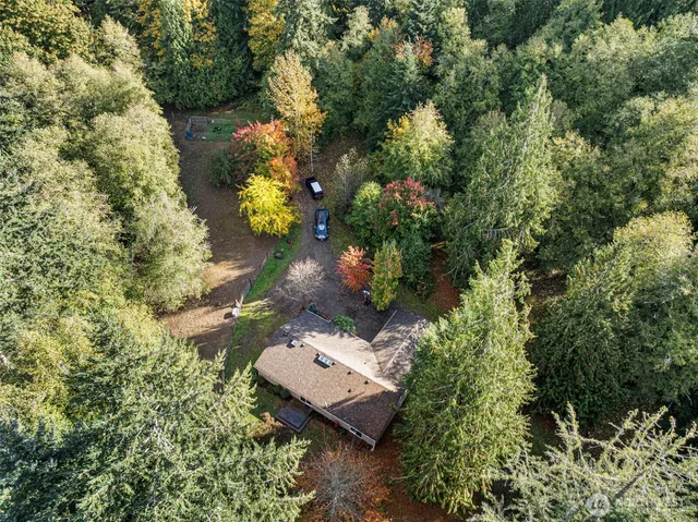 an aerial view of a house with a yard