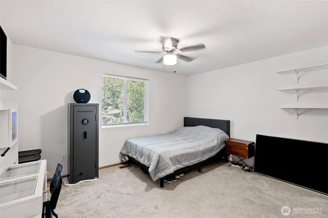 a bedroom with a bed and a window