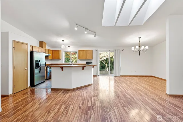 a view of kitchen with cabinets and stainless steel appliances