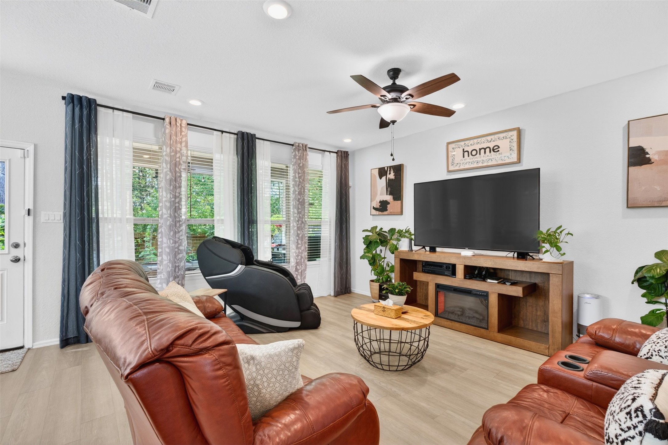 2832 Mistygate Court Conroe, TX 77301 - Photo 5 of 50 Spacious living room featuring natural light and a comfortable layout perfect for everyday living or entertaining.