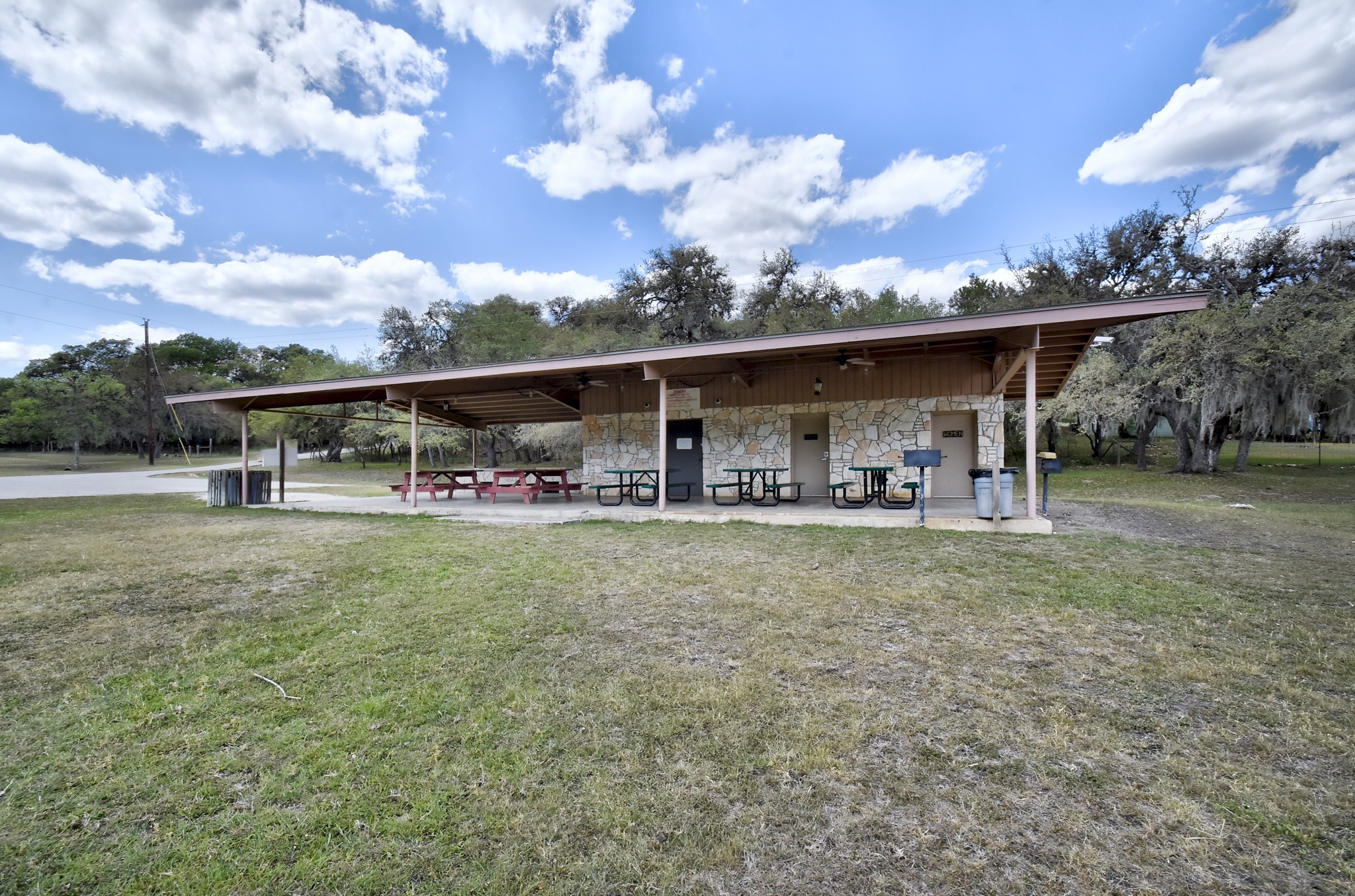 1170 Misty Lane Spring Branch, TX 78070 - Photo 24 of 24 A stone-clad covered patio provides an inviting spot for outdoor gatherings.