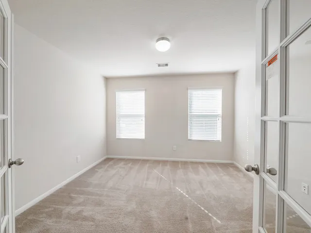 an empty room with windows