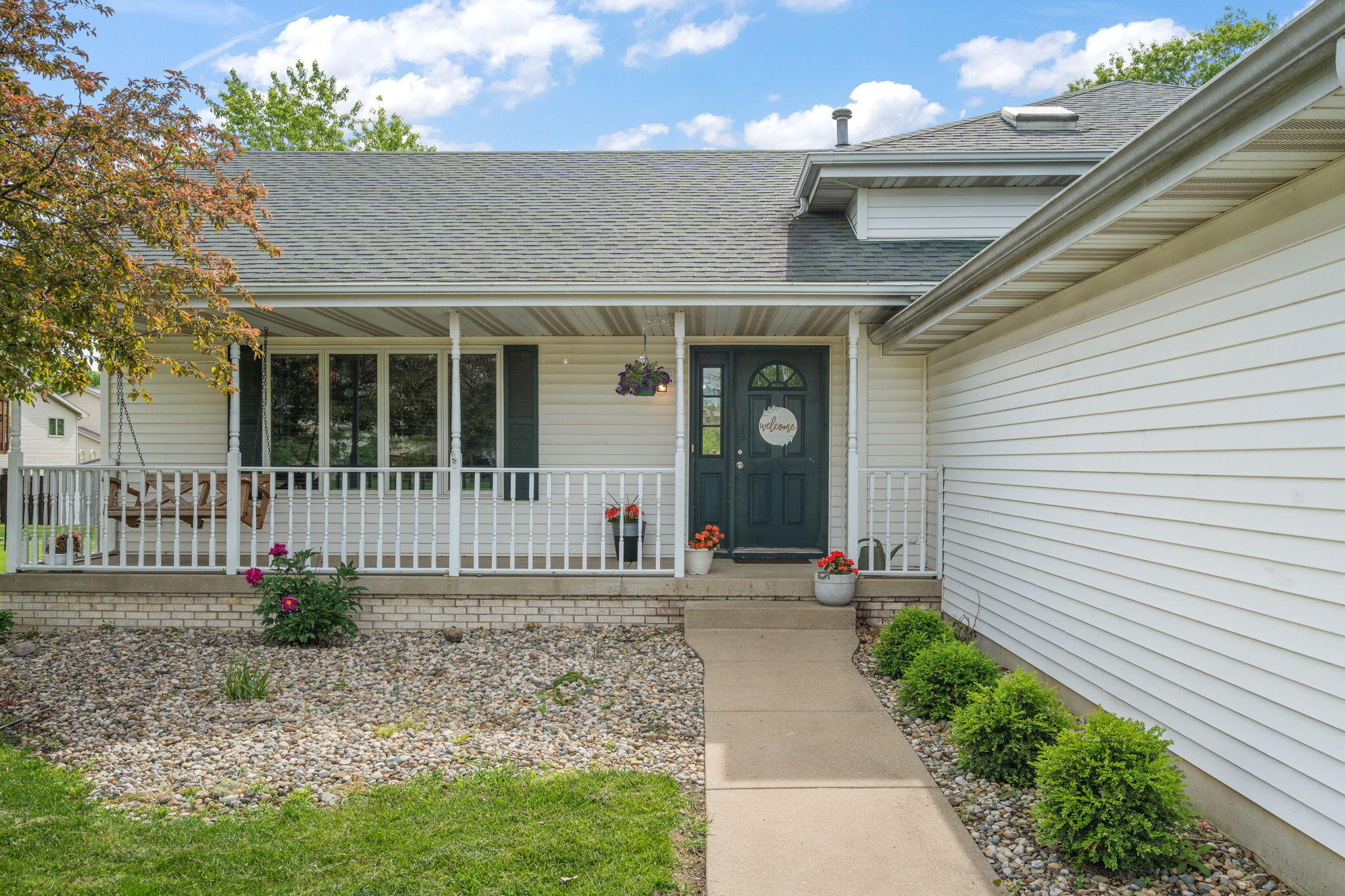 8987 Calhoun Place Crown Point, IN 46307 - Photo 3 of 28 a front view of a house with garden