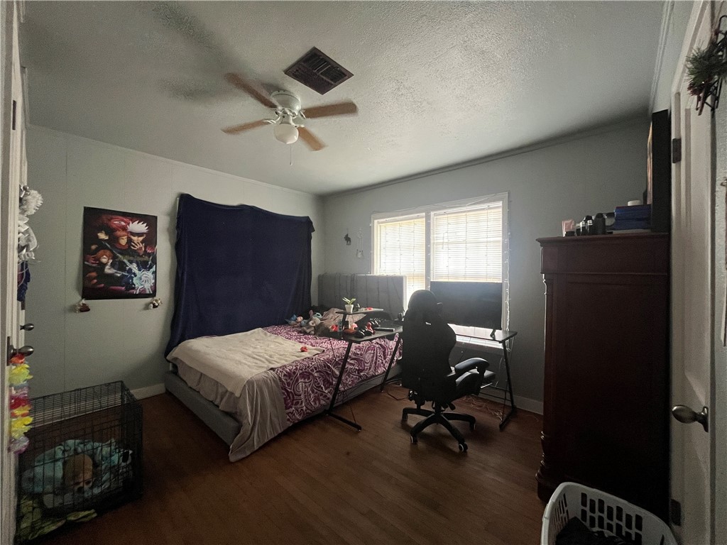1453 14th Street Corpus Christi, TX 78404 - Photo 17 of 23 a bedroom with a bed and a window