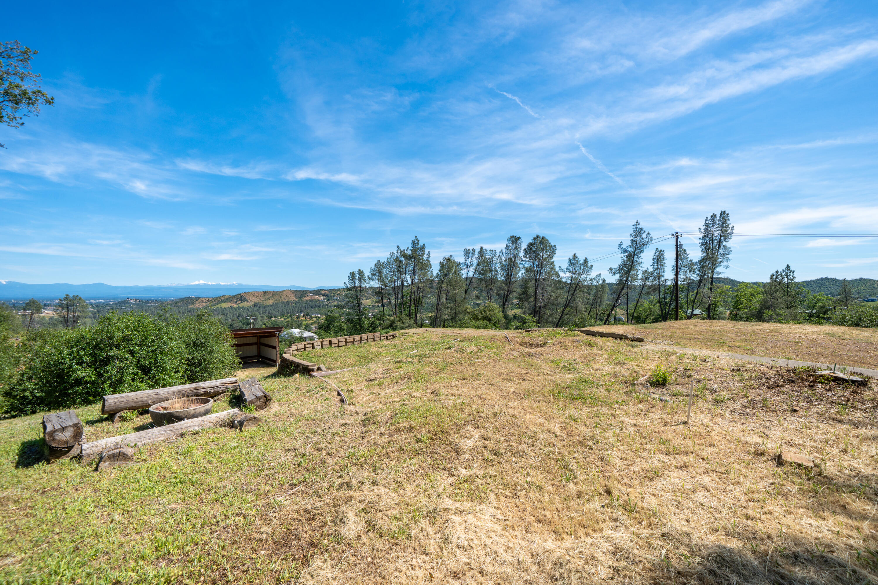 15809 Old Stage Coach Road Redding, CA 96001 - Photo 13 of 33 a view of a terrace with a bench