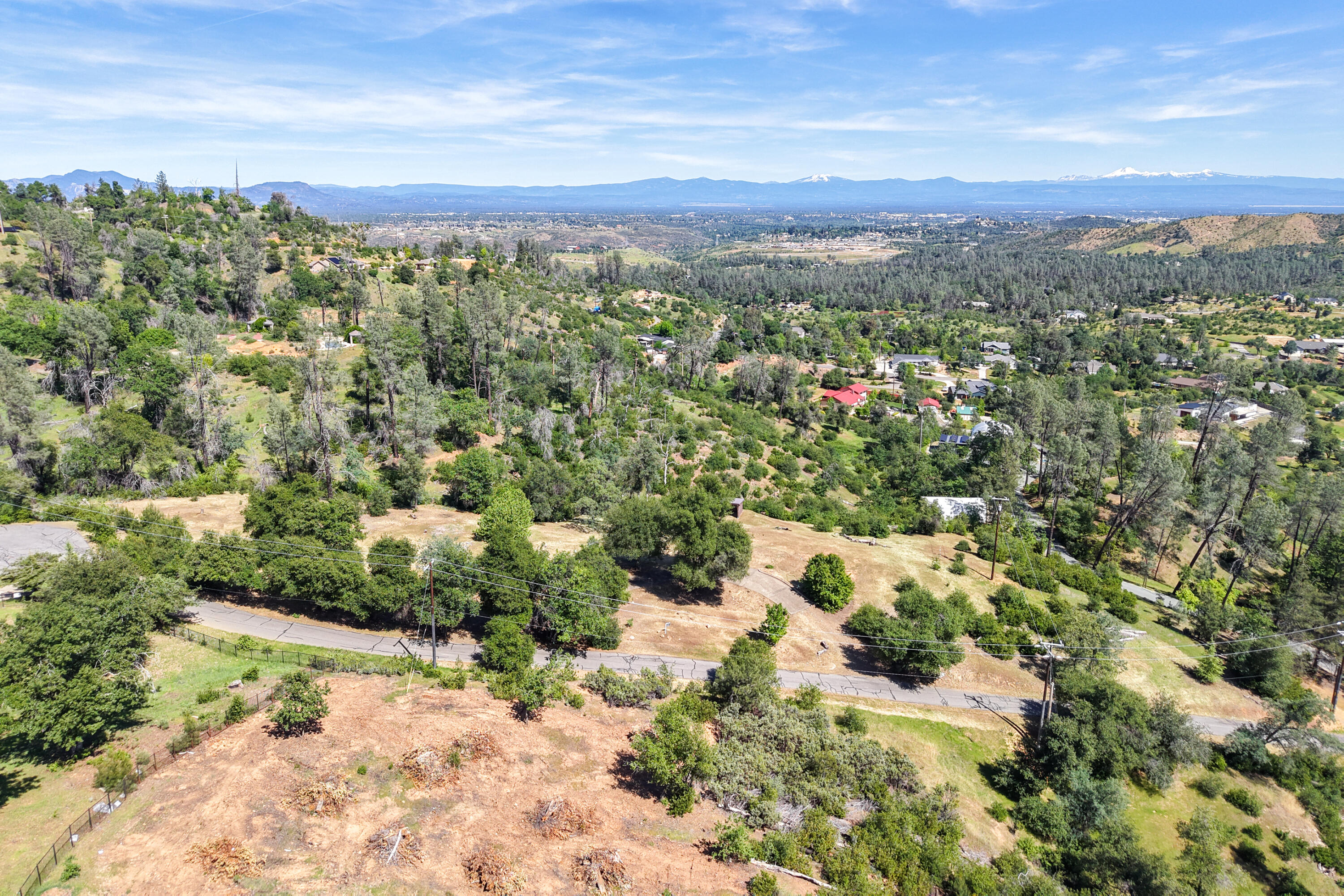 15809 Old Stage Coach Road Redding, CA 96001 - Photo 22 of 33 a view of a city with mountains in the background