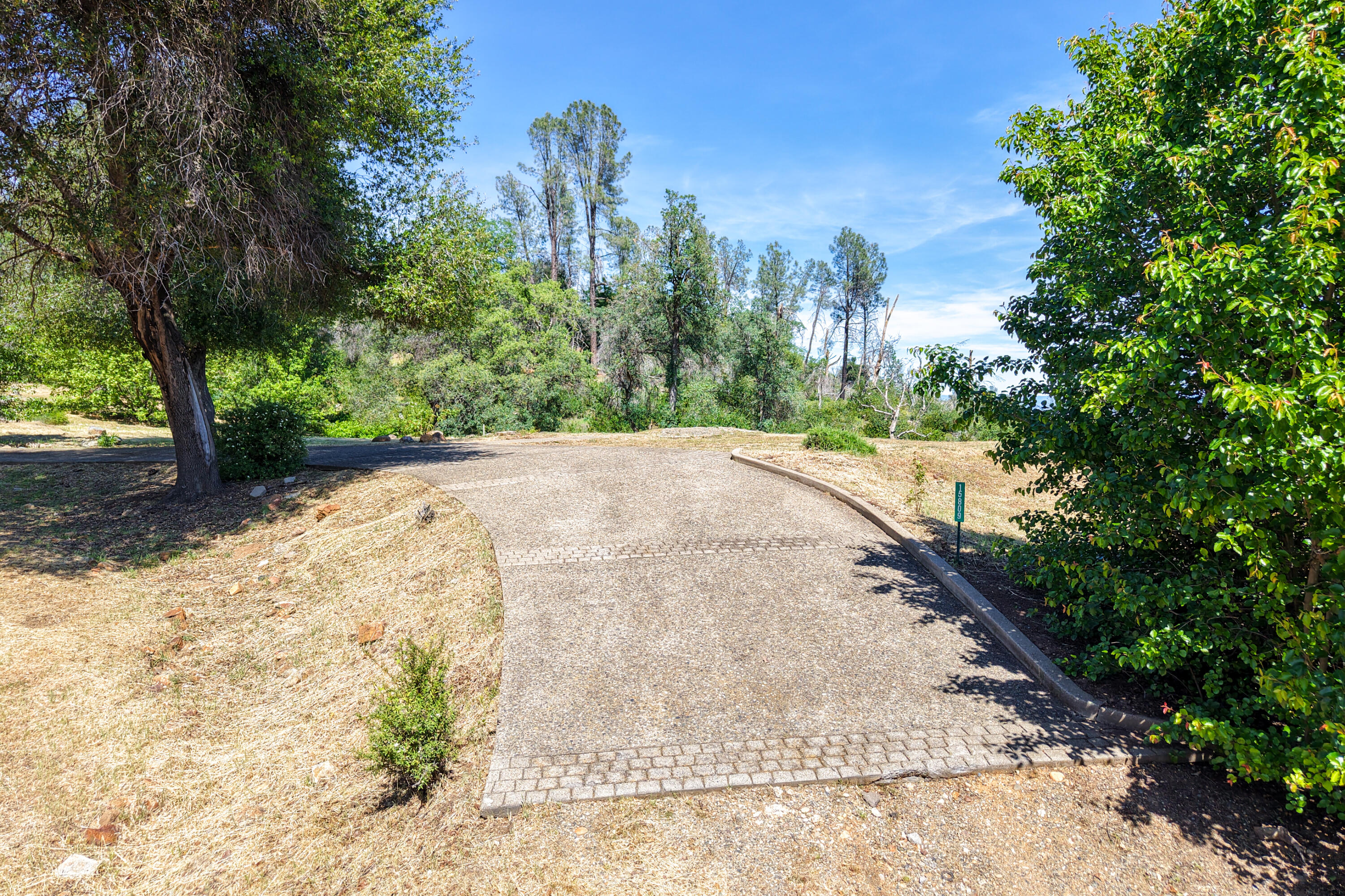 15809 Old Stage Coach Road Redding, CA 96001 - Photo 28 of 33 a view of a road with a yard