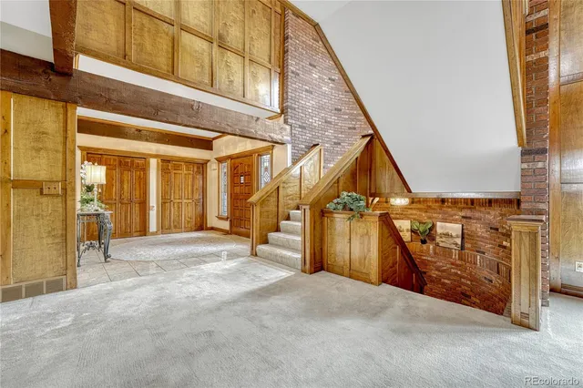 a kitchen with stainless steel appliances granite countertop a sink counter space cabinets and a window