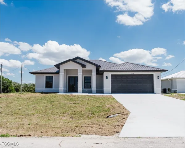 a house with trees in the background