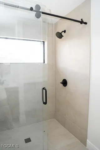 a bathroom with a double vanity sink and mirror