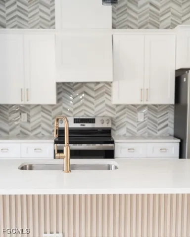 a kitchen with a stove and a microwave