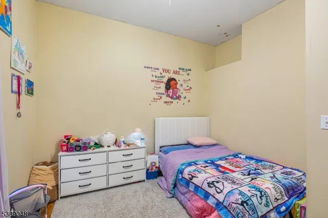 a bedroom with a bed and cabinets