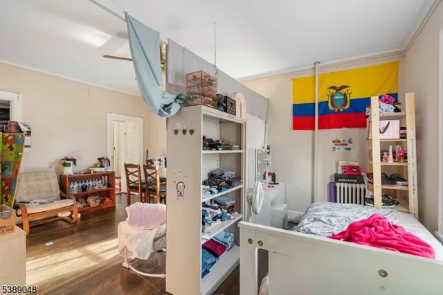 a living room with furniture and a book shelf