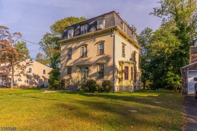 a view of a building with a yard