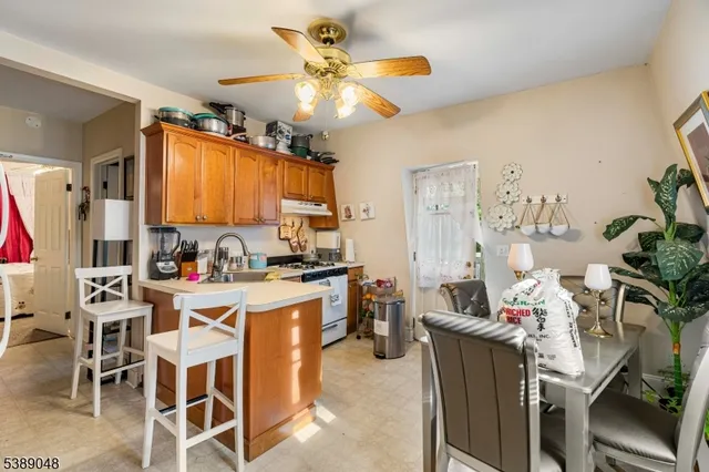 a view of kitchen with cabinets and furniture