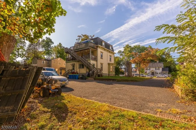 a view of a fountain in front of a house