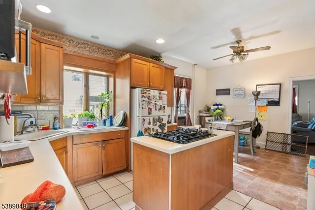 a kitchen that has a lot of cabinets in it and a sink