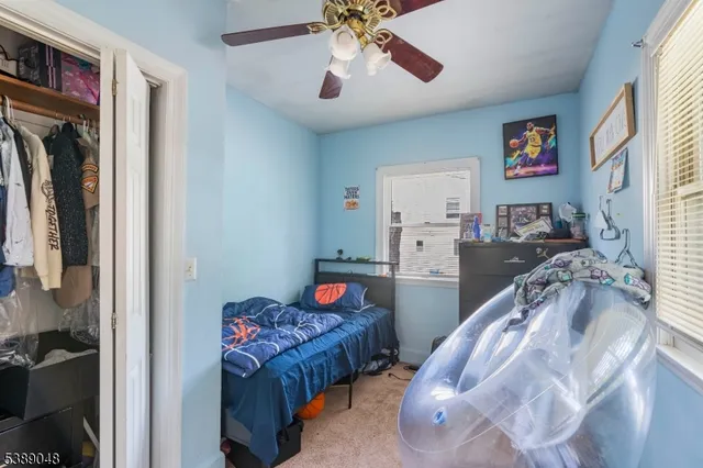 a bedroom with furniture and a chandelier