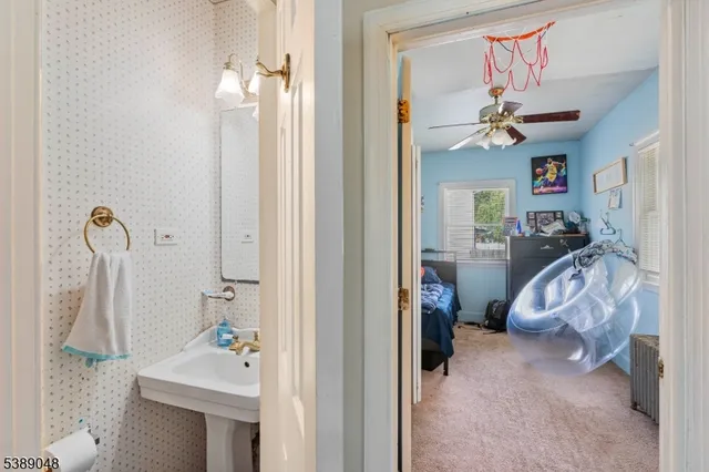 a view of a bedroom with a chandelier