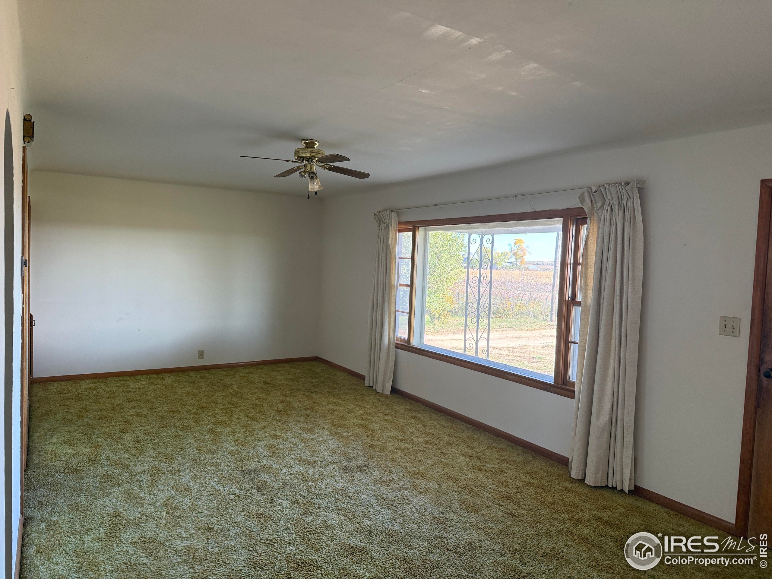 31123 County Road West Brush, CO 80723 - Photo 6 of 11 an empty room with a window