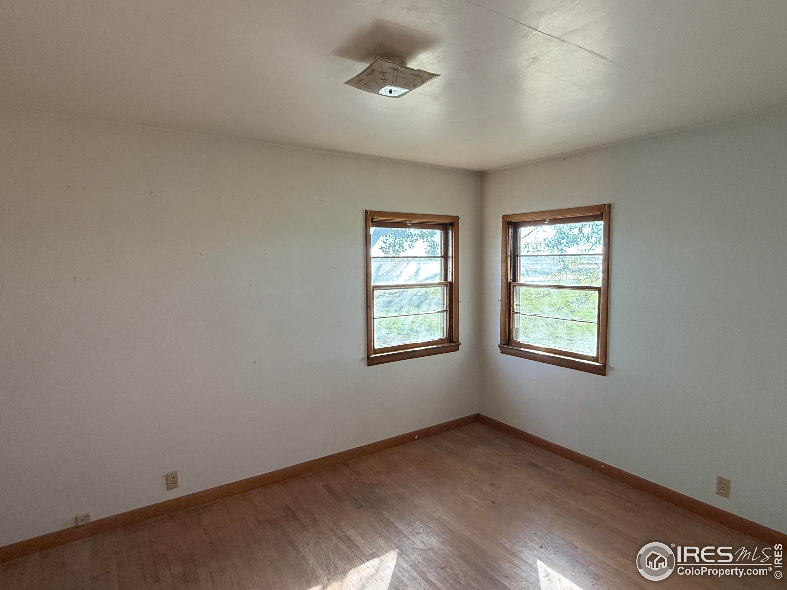 31123 County Road West Brush, CO 80723 - Photo 9 of 11 an empty room with windows