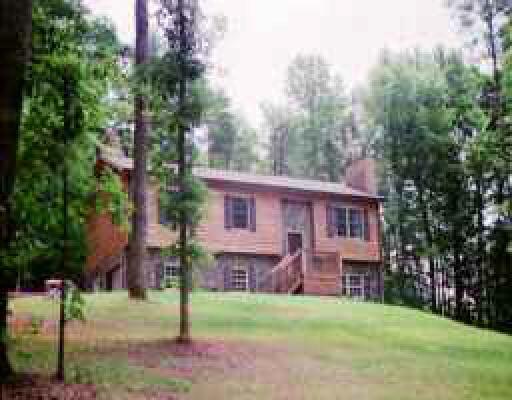 3492 Morgans Mill Road Goodview, VA 24095 - Photo 1 of 1 a view of a house with a yard and sitting area