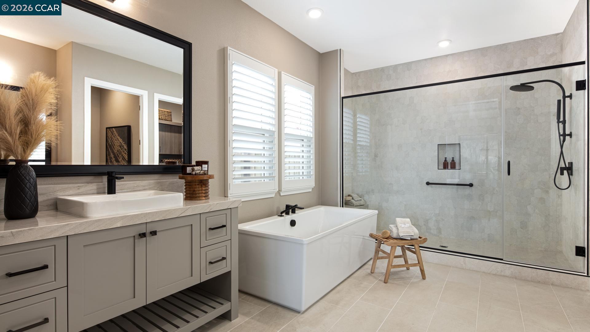 3144 Boca Way Tracy, CA 95377 - Photo 7 of 29 a bathroom with a double vanity sink a mirror and a shower