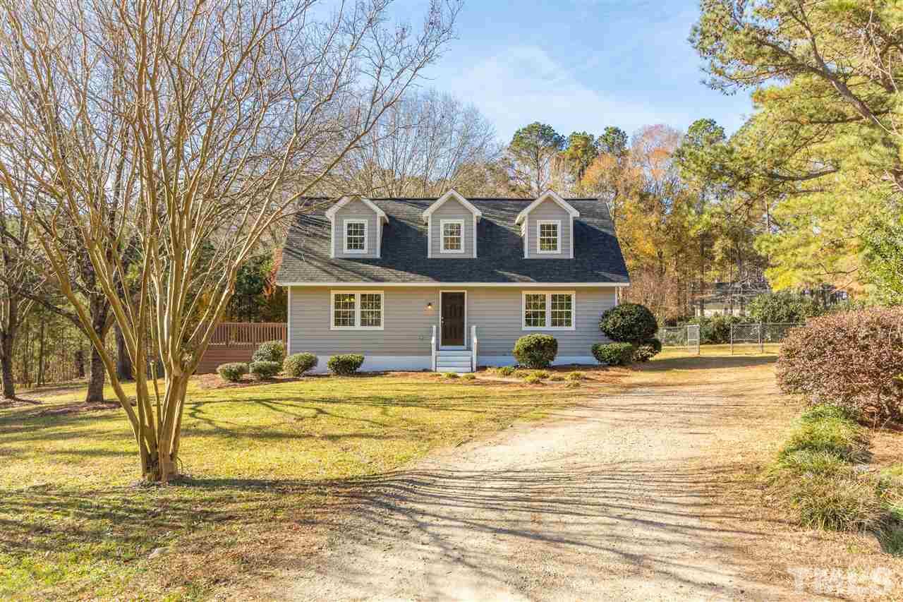 10616 Chelsea Drive Raleigh, NC 27603 - Photo 1 of 25 a front view of a house with a garden