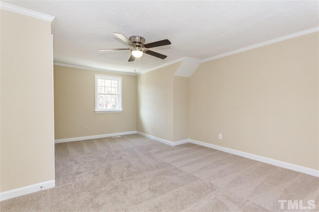 10616 Chelsea Drive Raleigh, NC 27603 - Photo 22 of 25 a view of an empty room with a window