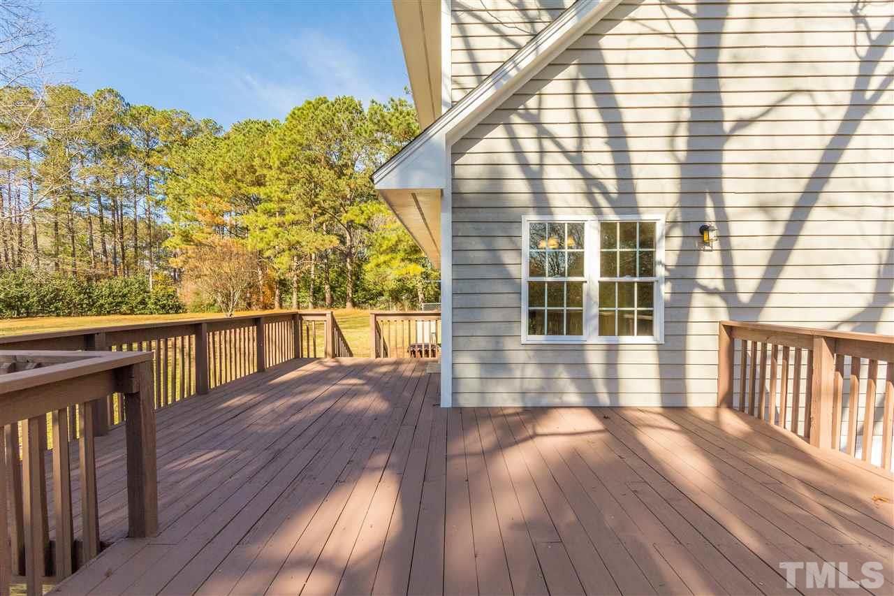 10616 Chelsea Drive Raleigh, NC 27603 - Photo 8 of 25 a view of a balcony with wooden floor and fence