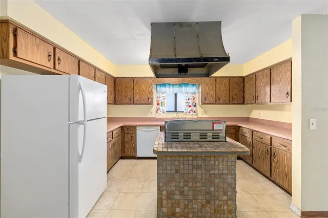 a kitchen that has a sink and a stove