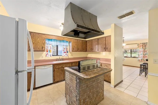 a kitchen with a stove and a cabinets
