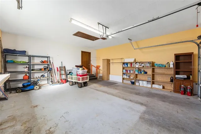a view of a spacious bedroom with a large window