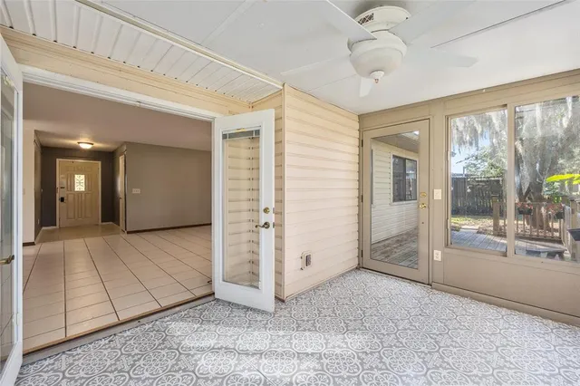a view of a house with a porch and garden