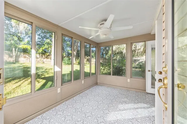 a view of a house with wooden fence