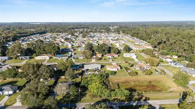 an aerial view of a house with swimming pool