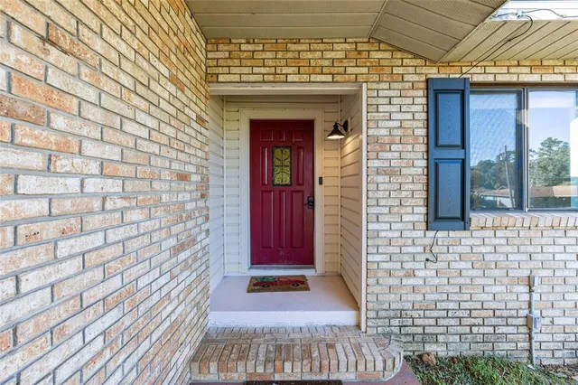 a view of entryway with a brick wall