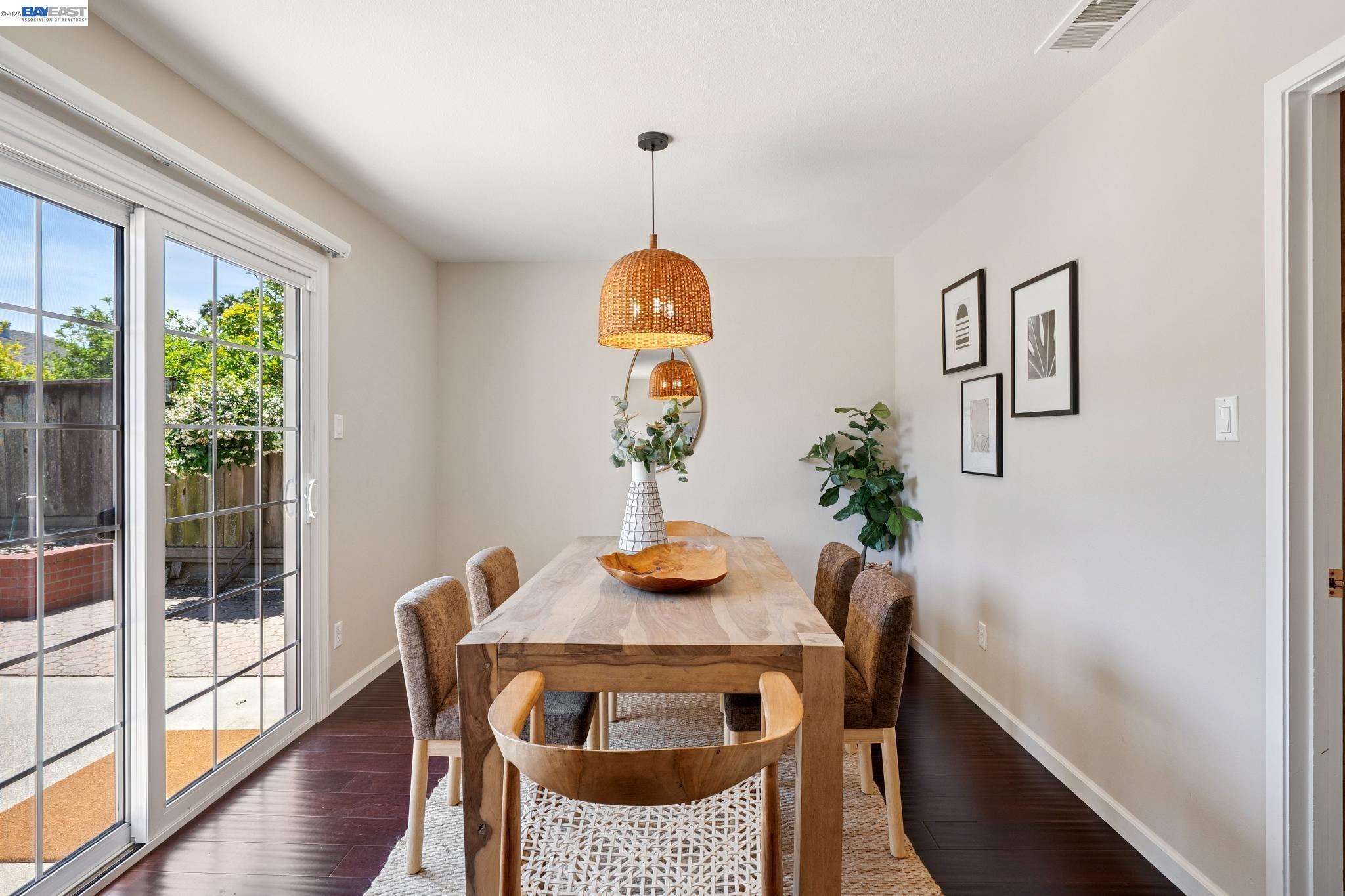 328 Sand Beach Road Alameda, CA 94501 - Photo 13 of 48 a view of a dining room with furniture window and wooden floor