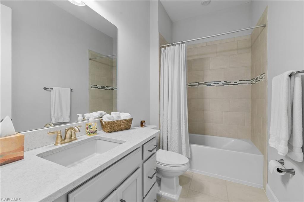 15345 Aprile Street Naples, FL 34114 - Photo 22 of 29 a bathroom with a sink toilet and shower