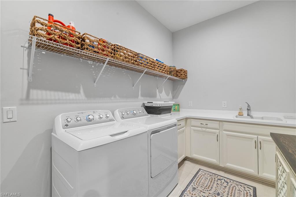 15345 Aprile Street Naples, FL 34114 - Photo 26 of 29 a utility room with dryer and washer
